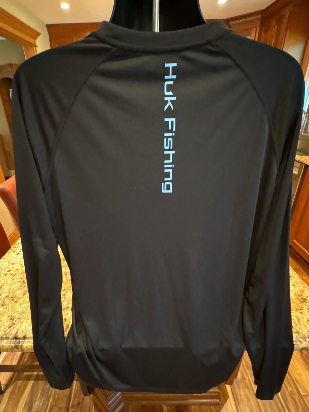 Huk men’s long sleeve performance Fishing Shirt. Sharp Black with blue logos.